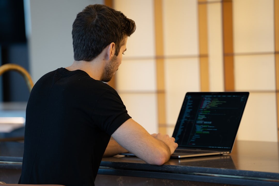 person learning to code on laptop